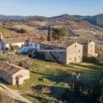 View of fixer upper farmhouse and pigsty in Umbria Italy