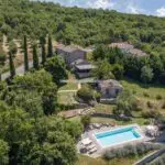 View of Italian country home and pool