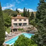 View of pool and luxury villa in Tuscany