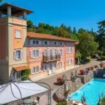View of Tuscan mansion villa and pool