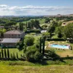 View of pool and Tuscan agriturismo
