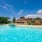 External view of pool and luxury villa home Lucignano Tuscany Italy